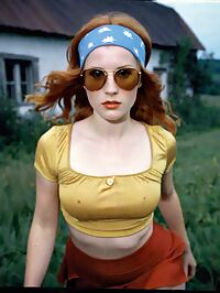 Woman in 1970s attire sporting ginger locks and D cup breasts in an old farmhouse
